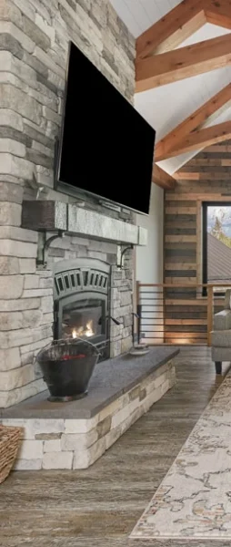 custom designed main living area with stone fireplace