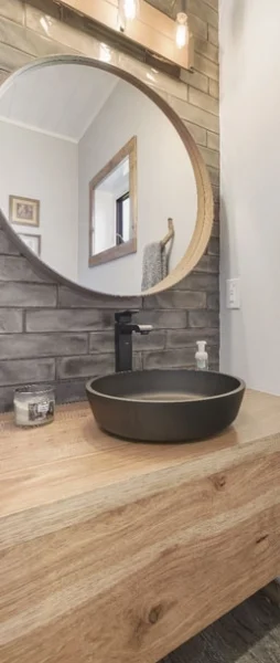 well designed bathroom with wood counter